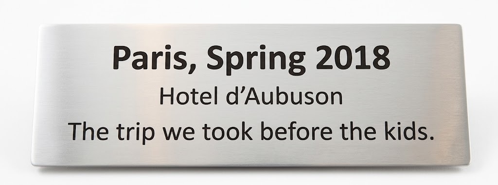 Engraved brass nameplate reading "The Beatles, Shea Stadium, August 15, 1965, The night Mom met Dad."