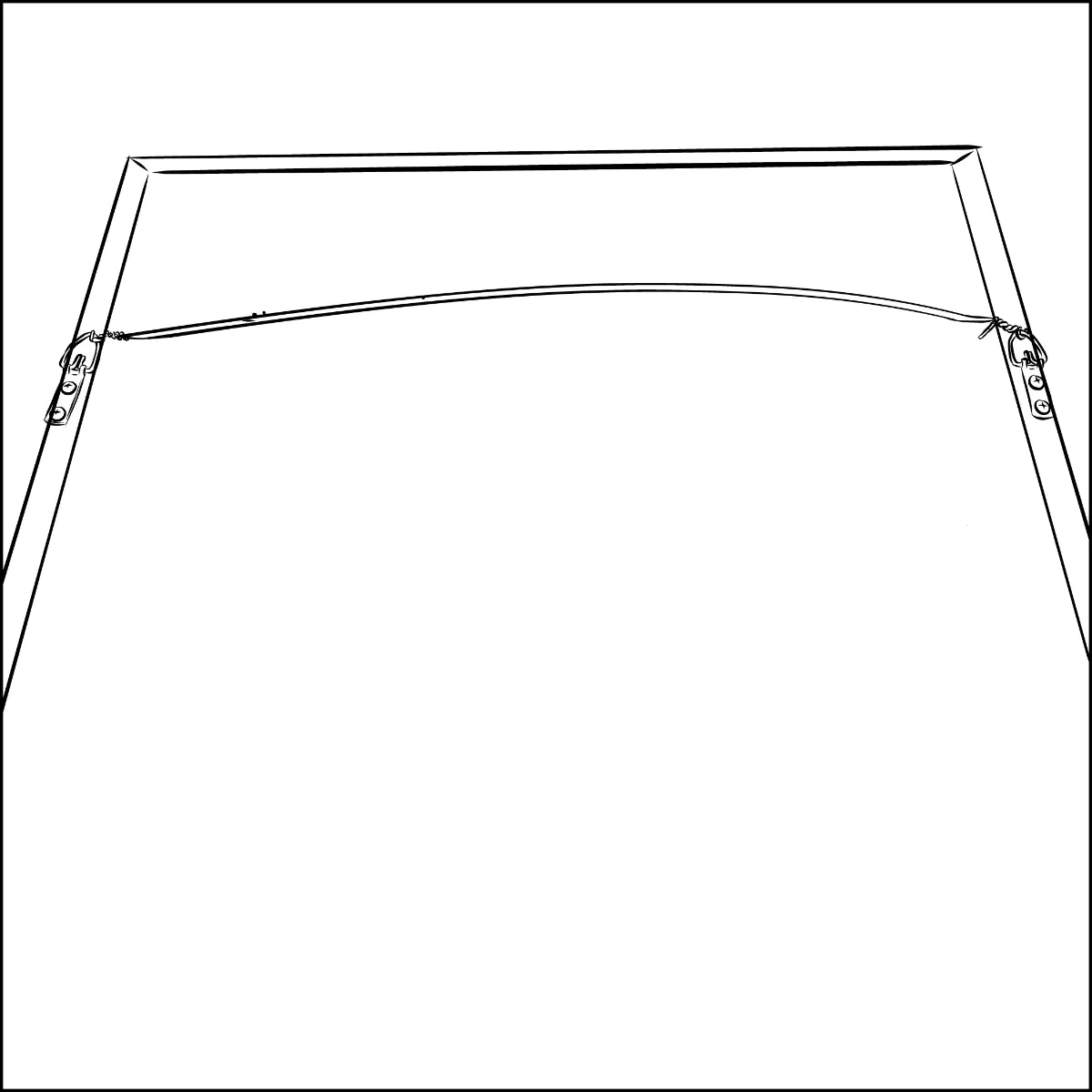 A hand wrapping the trimmed end of the picture wire around itself at the second D-ring, completing the loop-and-wrap that secures the wire on the frame.